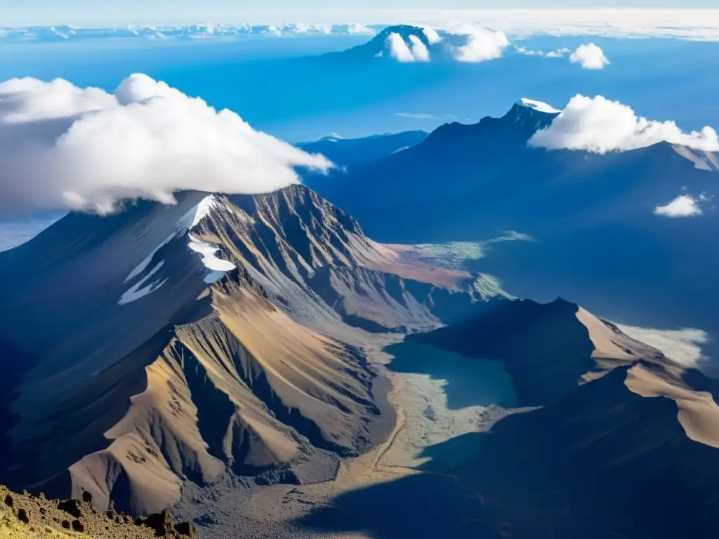 Misterios del Kilimanjaro: Vista aérea impresionante de la cumbre nevada, con nubes proyectando sombras dramáticas en sus escarpadas laderas